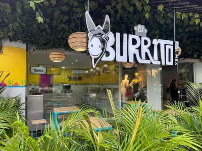 a burger restaurant with a sign that reads burger at Hotel Sun Suite in Barranquilla