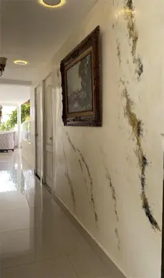 a room with a wall with a painting on it at Balcones de Venecia in Cartagena de Indias
