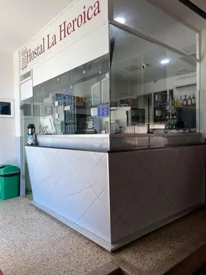 a restaurant with a counter in a store at Hostal La Heroica in Cartagena de Indias