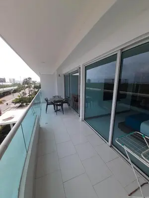 a balcony with a table and a view of the ocean at Cartagena Boquilla Morros playa apt 1 in Cartagena de Indias