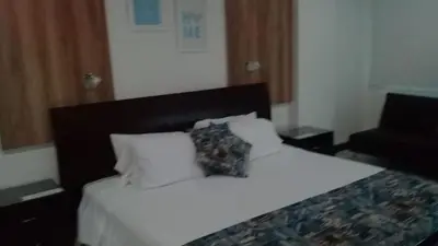 a bedroom with a bed with white sheets and pillows at APTO EN LA BOQUILLA CARTAGENA MORROS 922 in Cartagena de Indias