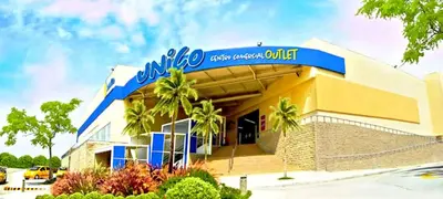 a building with a blue sign on top of it at La Quinta Bacana in Barranquilla