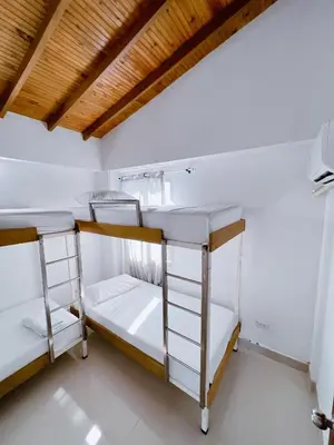 two bunk beds in a room with a wooden ceiling at Condominio bahia blanca in Coveñas