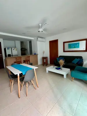 a living room with a table and a couch at Apartamento en cartagena Boquilla vista al mar dos Hab in Cartagena de Indias