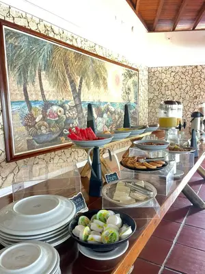 a buffet with plates of food on a table at Hotel Cocoliso Island Resort in Isla Grande