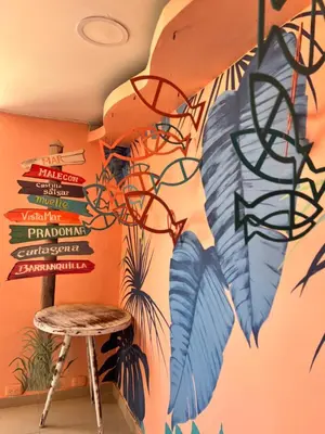 a room with a bunch of signs on the wall at Hotel Puerto Colombia in Puerto Colombia