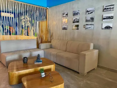 a living room with a couch and a coffee table at Hotel Puerto Colombia in Puerto Colombia
