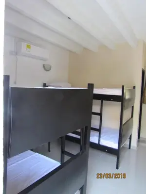 a room with two bunk beds in a room at Hotel Del Mar Inn in Barranquilla