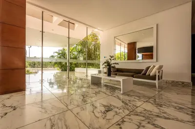 a living room with a marble floor and a couch at Edificio Morros Vitri Lujo con Panorama in Cartagena de Indias