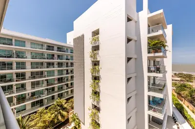 an aerial view of a white building with palm trees at Edificio Morros Vitri Lujo con Panorama in Cartagena de Indias