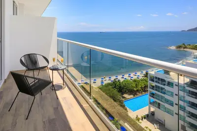 a balcony with a view of the ocean at Santa Marta Marriott Resort Playa Dormida in Santa Marta