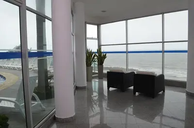 a room with chairs and a view of the ocean at palmetto frente al mar in Cartagena de Indias