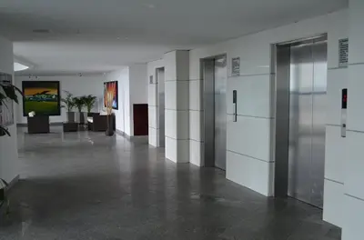 a hallway with white walls and doors in a building at palmetto frente al mar in Cartagena de Indias