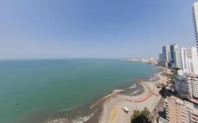 an aerial view of a beach with buildings and the ocean at palmetto frente al mar in Cartagena de Indias