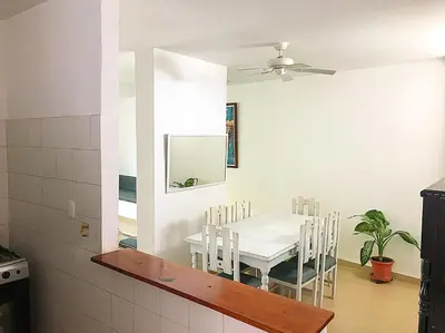 a dining room with a table and chairs and a mirror at Calle de la iglesia 35-59 in Cartagena de Indias