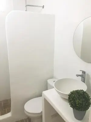 a bathroom with a sink and a toilet and a mirror at Calle de la iglesia 35-59 in Cartagena de Indias