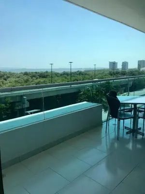 a balcony with a table and chairs on a building at Cartagena Morros playa edificio frente al mar 1 in Cartagena de Indias