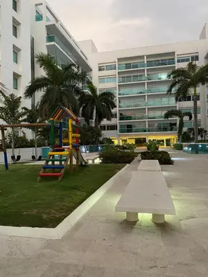 a park with a playground in front of a building at Cartagena Morros playa edificio frente al mar 1 in Cartagena de Indias