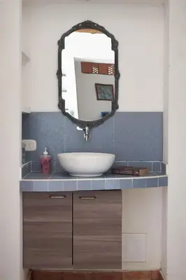 a bathroom with a sink and a mirror at Casa Caracola in Tubará