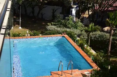 a large blue swimming pool in a yard at Casa en Santa Veronica Atlantico in Santa Veronica
