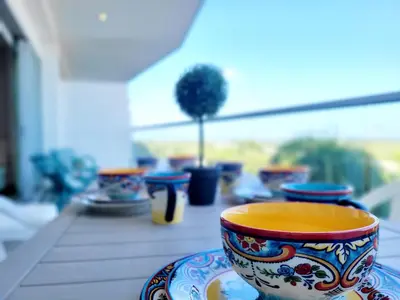 a row of colorful bowls sitting on a table at Apartamento en Cartagena primera linea de Playa Morros Epic in Cartagena de Indias