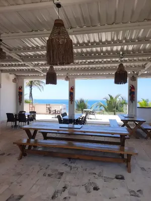 a pool table in a room with a view of the beach at Hotel Rilux Tolú -Casa Danae- in Tolú