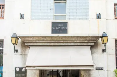 a building with a sign over a door at Apartamento Ganem 505a in Cartagena de Indias