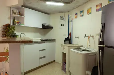 a kitchen with white cabinets and a sink at Apt frente al Mar 10 min a pie Centro Histórico in Cartagena de Indias