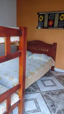 a bedroom with two bunk beds in a room at Cabaña La Fortaleza in Tolú