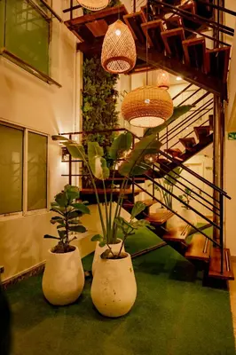 two large pots with plants in them next to a staircase at Casa Amanzi Cartagena by Bernalo Hotels in Cartagena de Indias