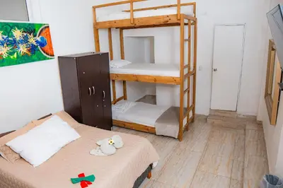 a small room with two bunk beds in it at Hostal Badillo SV in Cartagena de Indias
