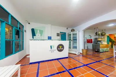 a room with a kitchen and a floor with orange tiles at Hotel Ayenda Cartagena Blue 1804 in Cartagena de Indias