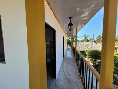 a hallway of a house with an open door at Alojamiento Bityn in Paso Nuevo