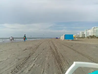 a group of people walking on the beach at JUNTO AL MAR Y EL MANGLAR in Cartagena de Indias
