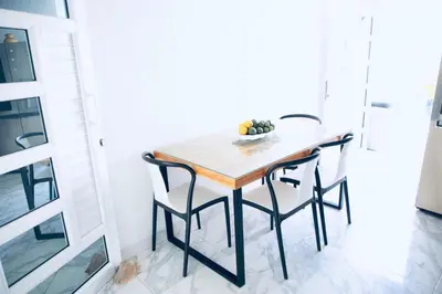 a dining room table and chairs in a room at Le MARIE B&B in Cartagena de Indias