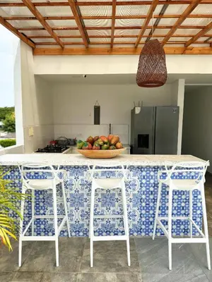 a kitchen with a counter with a bowl of fruit at Le MARIE B&B in Cartagena de Indias
