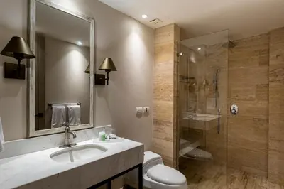 a bathroom with a sink and a shower and a toilet at Eurostars Marqués de Villalta in Cartagena de Indias