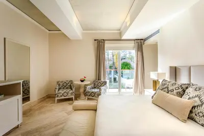a bedroom with a large bed and a window at Eurostars Marqués de Villalta in Cartagena de Indias