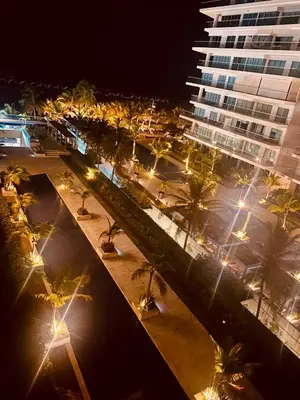 a city at night with palm trees and a building at MORROS EPIC luxury in Cartagena de Indias