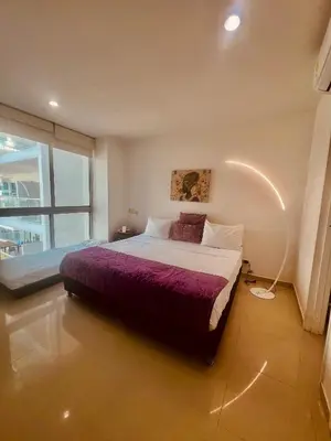a bedroom with a large bed and a large window at MORROS EPIC luxury in Cartagena de Indias