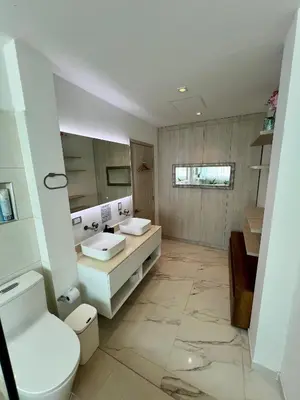 a bathroom with two sinks and a toilet at Ritacuba House Boutique in Santa Marta