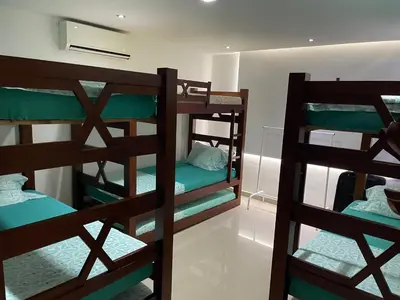 two sets of bunk beds in a room at APARTMENT WHITE BOCAGRANDE - Los Delfines in Cartagena de Indias