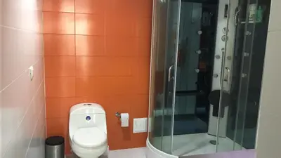 a bathroom with a toilet and a shower at APARTMENT WHITE BOCAGRANDE - Los Delfines in Cartagena de Indias