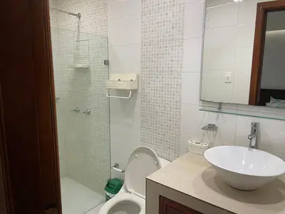 a bathroom with a sink and a toilet and a shower at APARTMENT WHITE BOCAGRANDE - Los Delfines in Cartagena de Indias