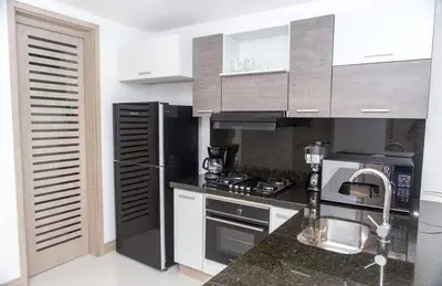a kitchen with stainless steel appliances and a counter top at Modern 1BR WiFi Breathtaking Oceanviews by Huespedia in Cartagena de Indias