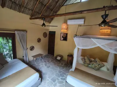 a bedroom with two beds in a room at Eco Xata in Santa Veronica