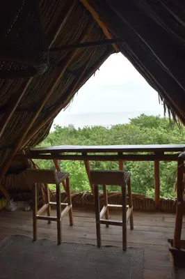 two chairs sitting on a porch in a tent at Eco Xata in Santa Veronica