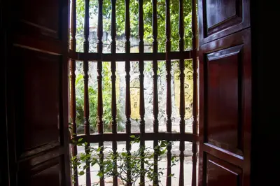 an open door with a wrought iron gate at Casa San Benito Abad in Cartagena de Indias