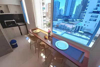 a kitchen with a table and a large window at Comodo Apartamento en Bocagrande Cartagena 801B in Cartagena de Indias