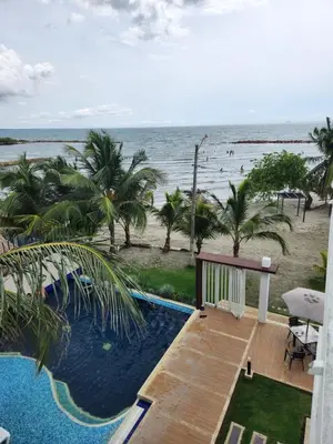 a view of the ocean from the balcony of a resort at Costa Serena Casa 3 in Coveñas